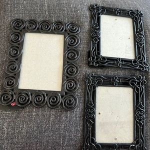 Three Black Metal Frames.